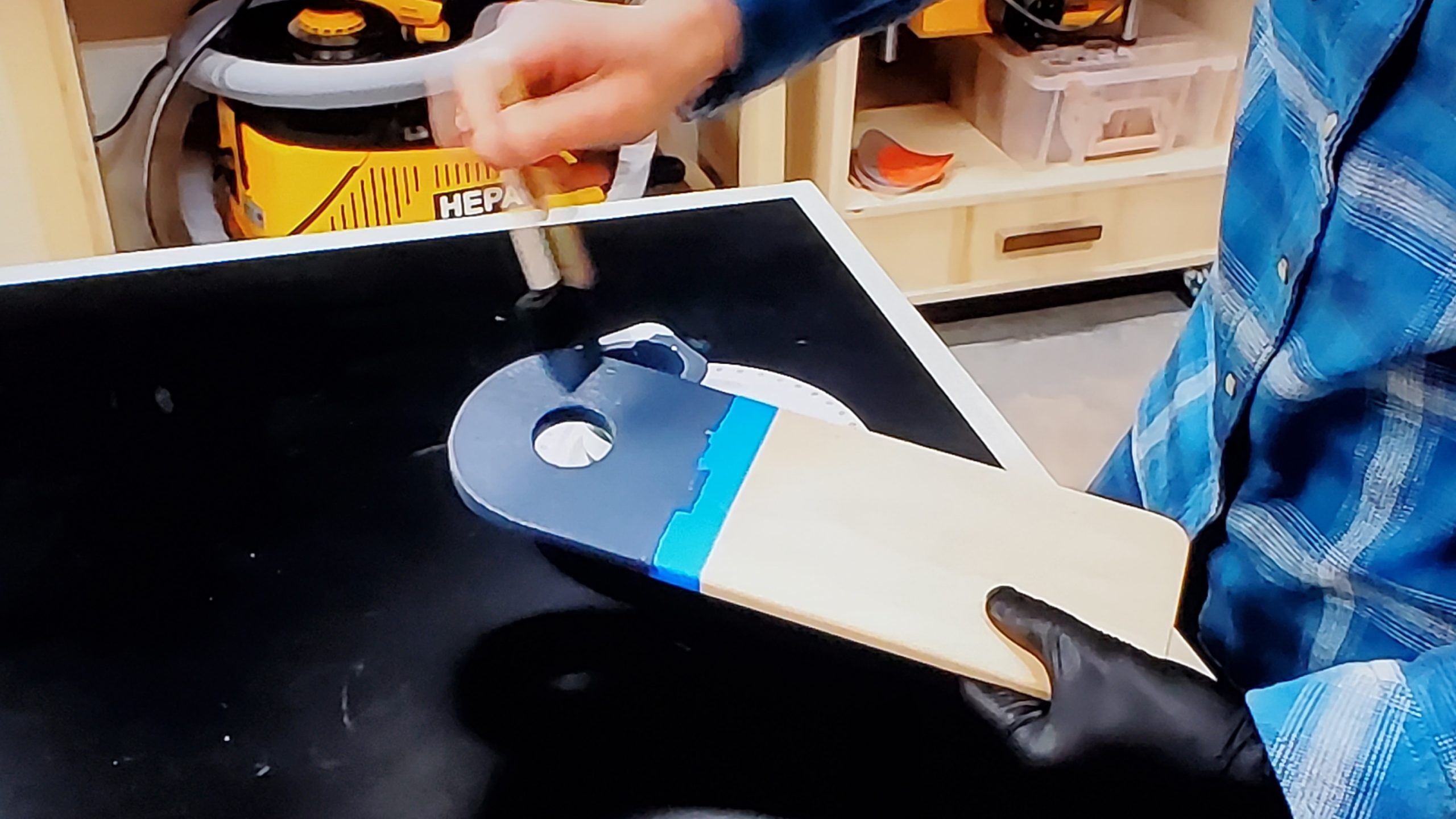 Ben applying finish to a cutting board in his West Virginia shop