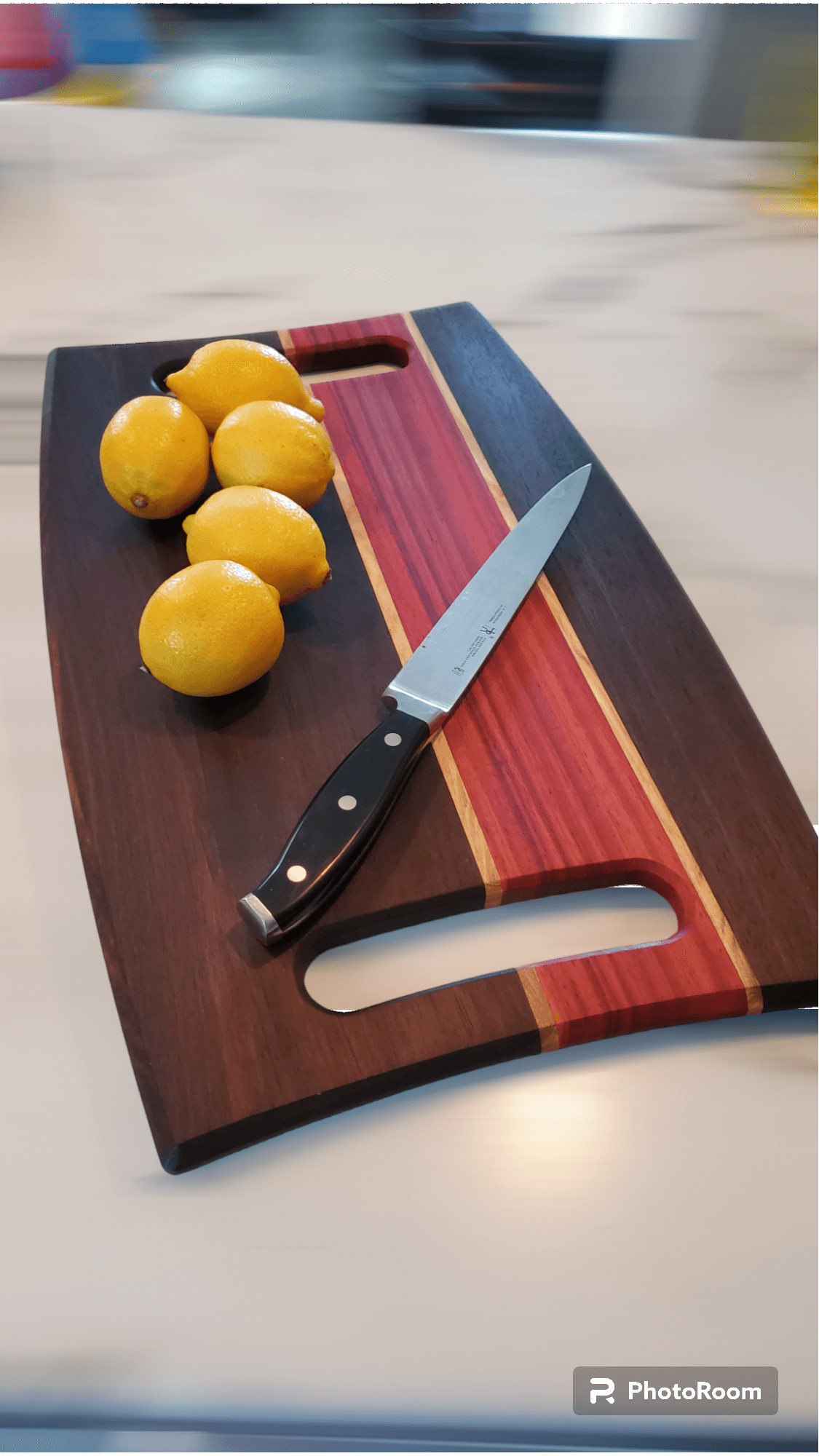 Charcuterie board with chef knife and lemons